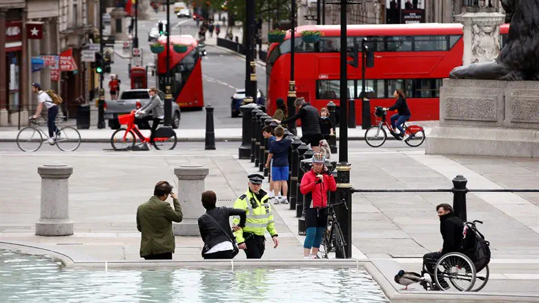 London: Police investigating after woman sets fire to Israeli flag