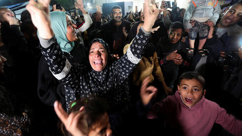 Gazans celebrate cease-fire deal, Hamas terrorists join crowd