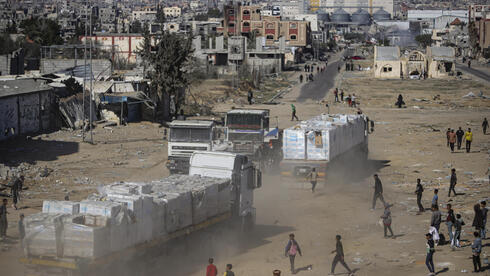 Aid trucks flood Gaza amid cease-fire, sharply cutting