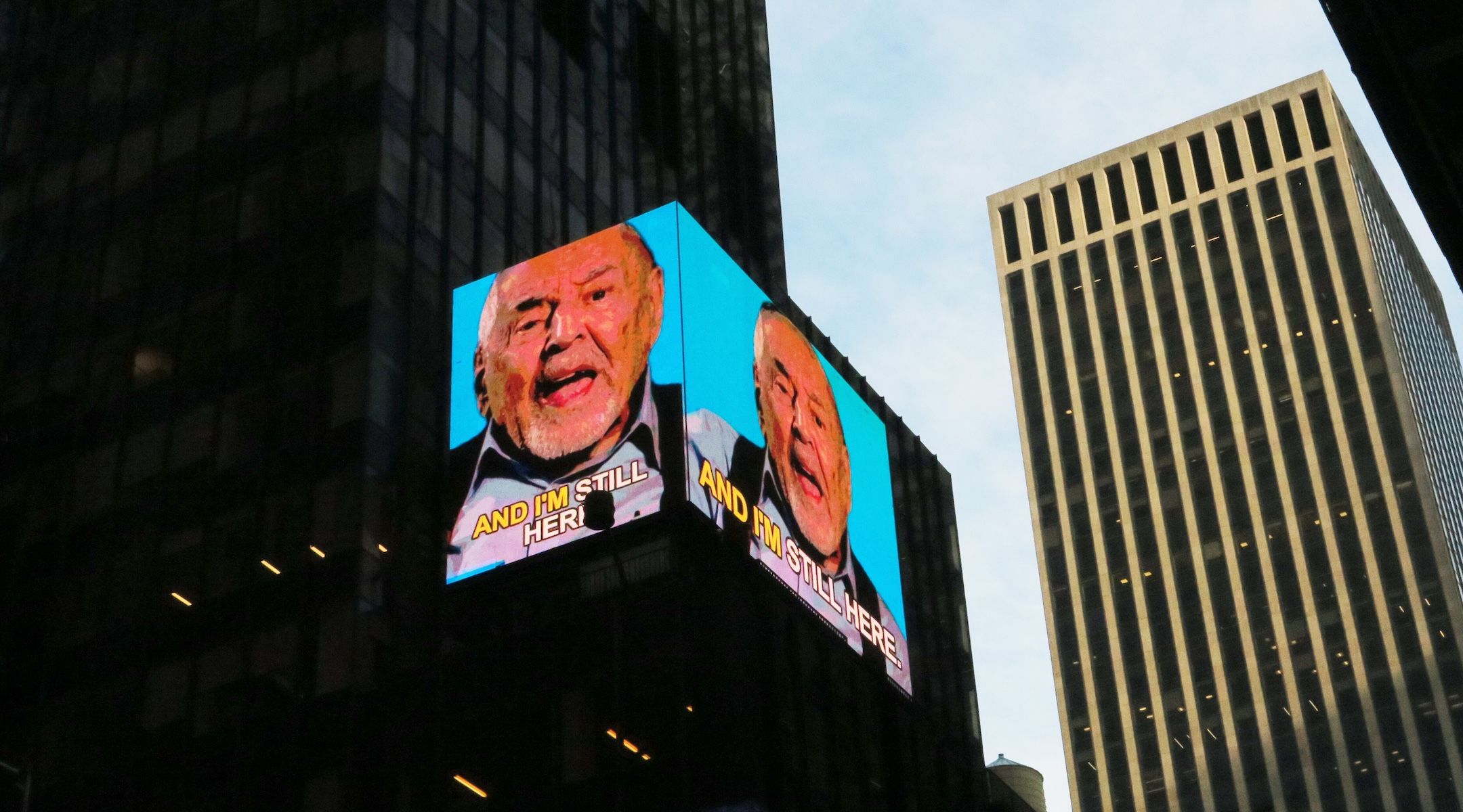 12 Holocaust survivors share their stories on a Times Square billboard