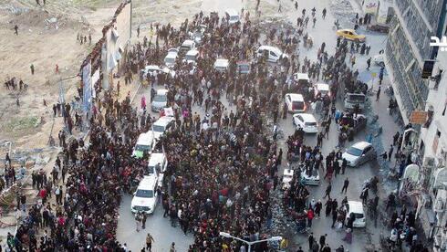 the chaos at Gaza’s central square as hostages released