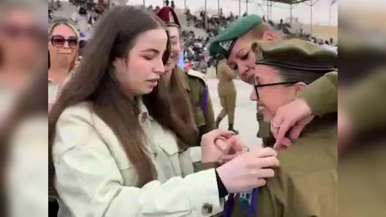 Moving video: Agam Berger presents sister with military lanyard at graduation