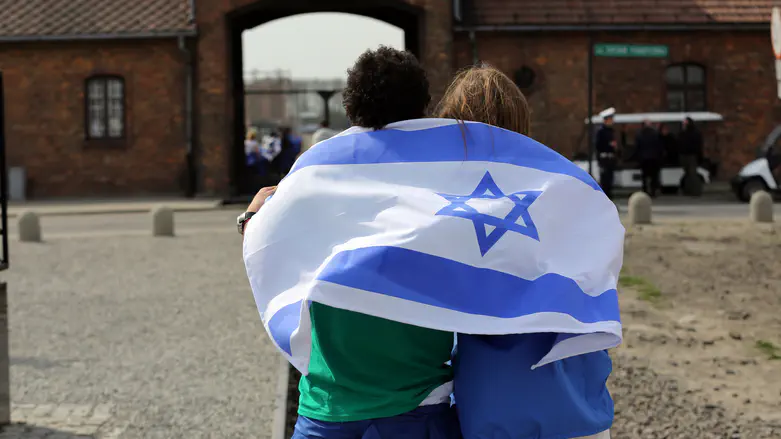 Israeli flags bearing hostage ribbons confiscated from Jewish group touring Auschwitz