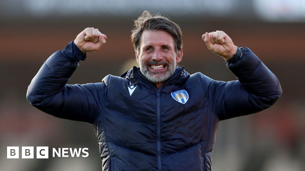 Colchester United players take taxis to match after flat tyre
