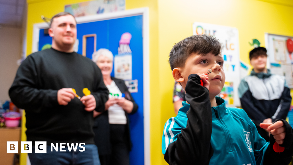 Luke Littler brings joy to young patients at Warrington Hospital