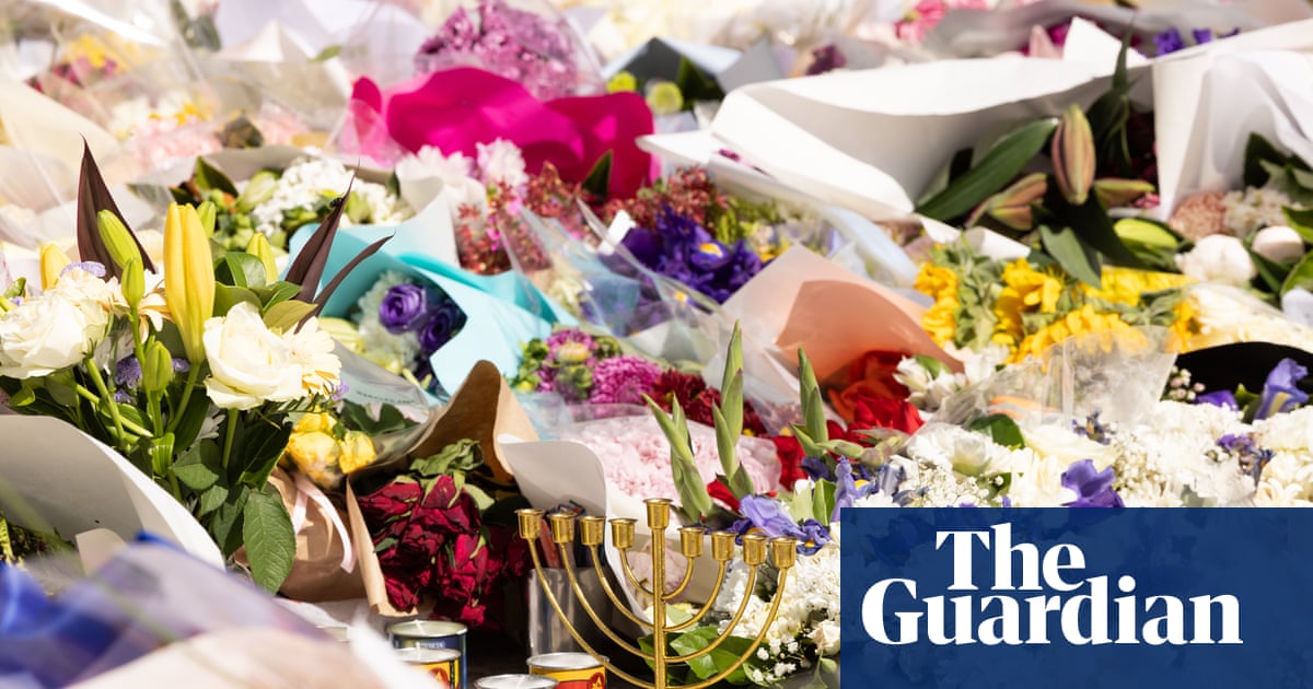 Crowds gather on third day of Bondi beach shooting memorial – in pictures – The Guardian