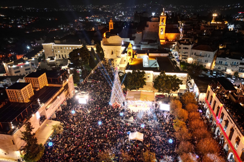 Christmas returns to Bethlehem as tree lights up for first time since Gaza war began Christmas returns to Bethlehem as tree lights up for first time since Gaza war began