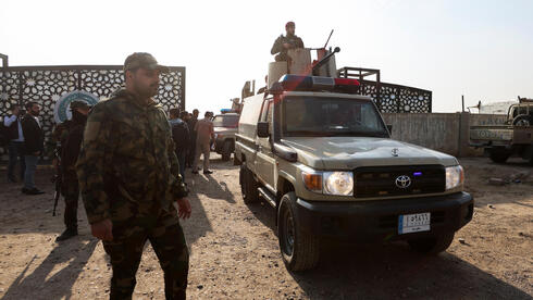 under pressure, Iran-backed militias in Iraq signal