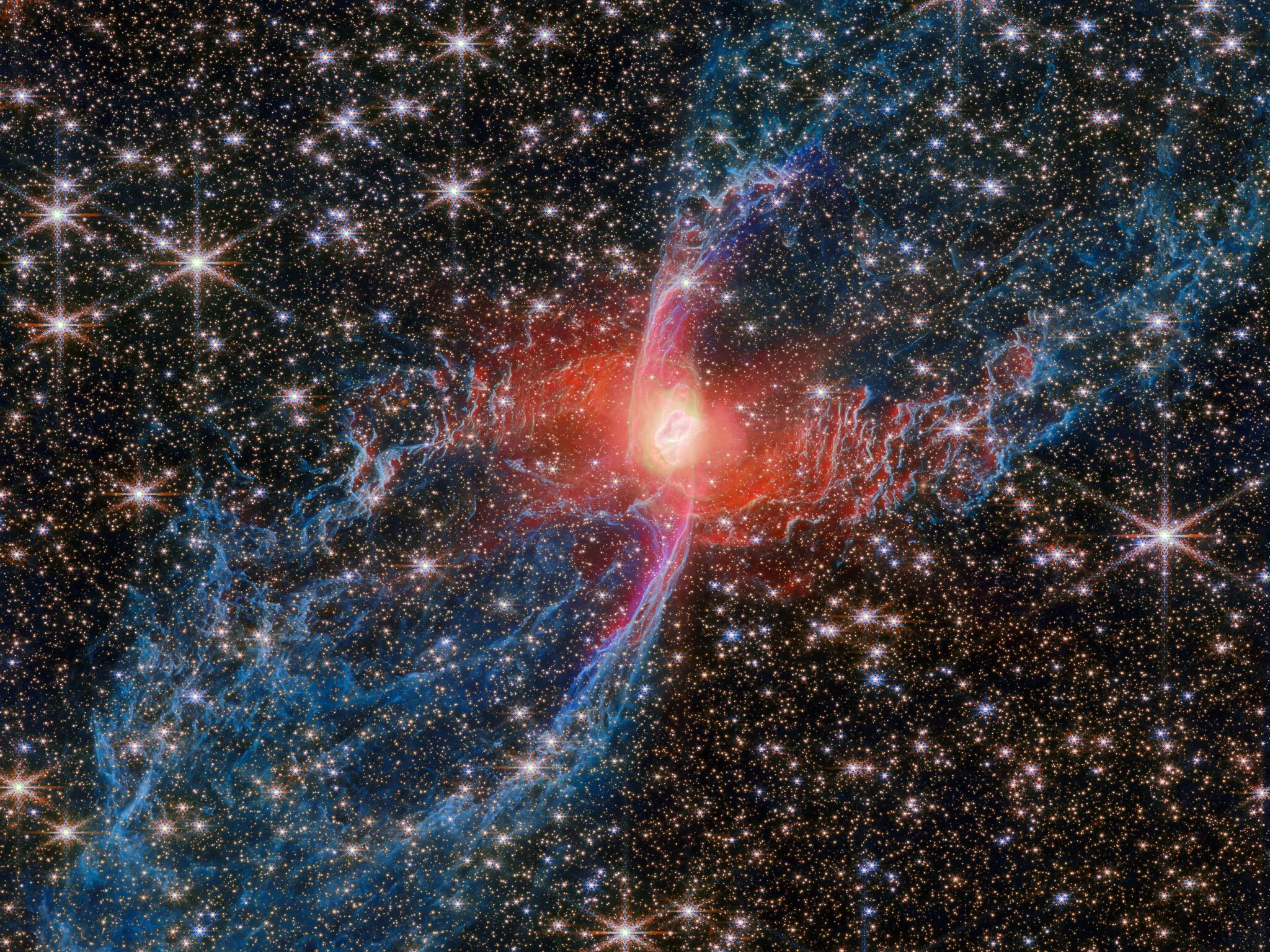 Webb Telescope Uncovers Vast Hidden ‘Legs’ Of The Red Spider Nebula