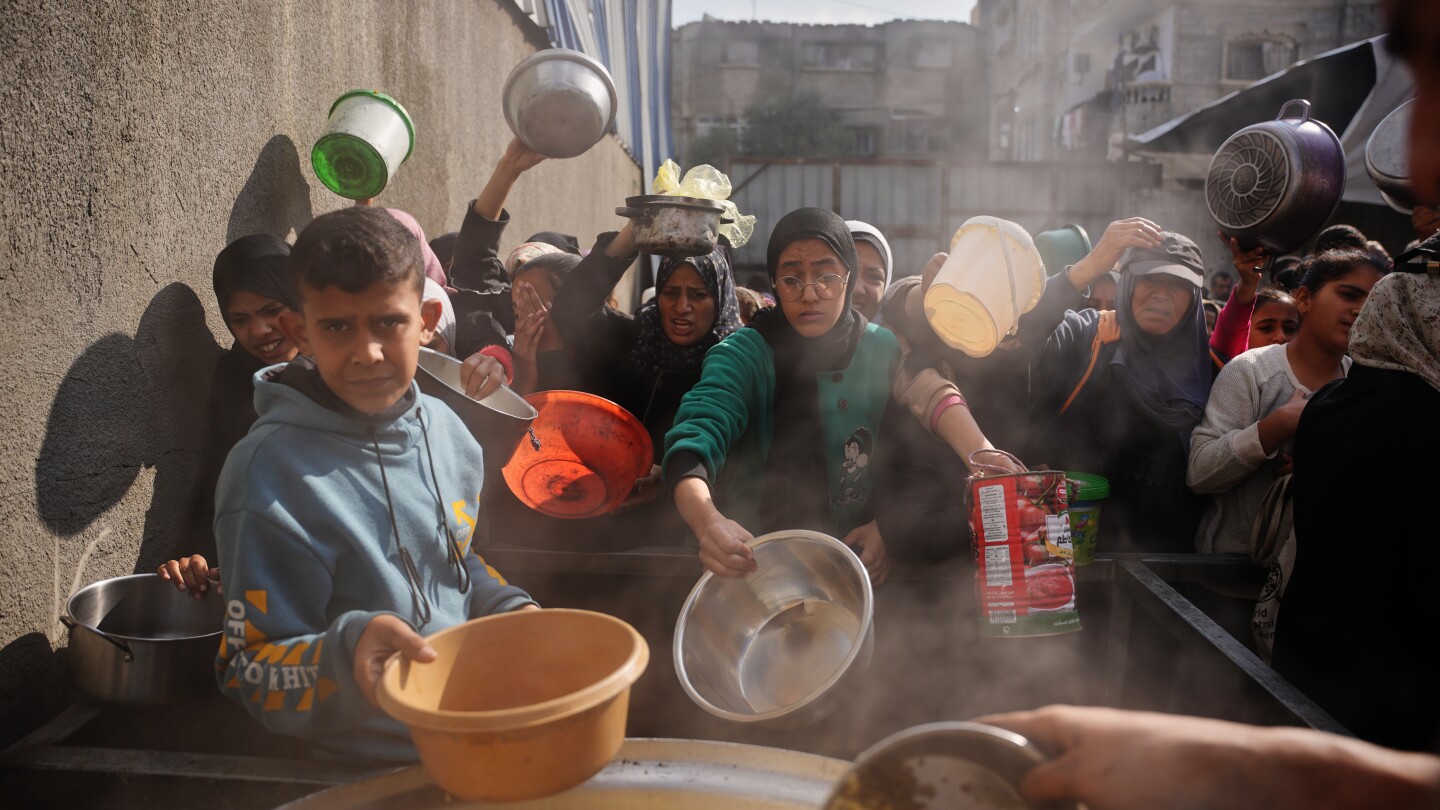 Israel fires mortar into Gaza residential area, wounding at least 10