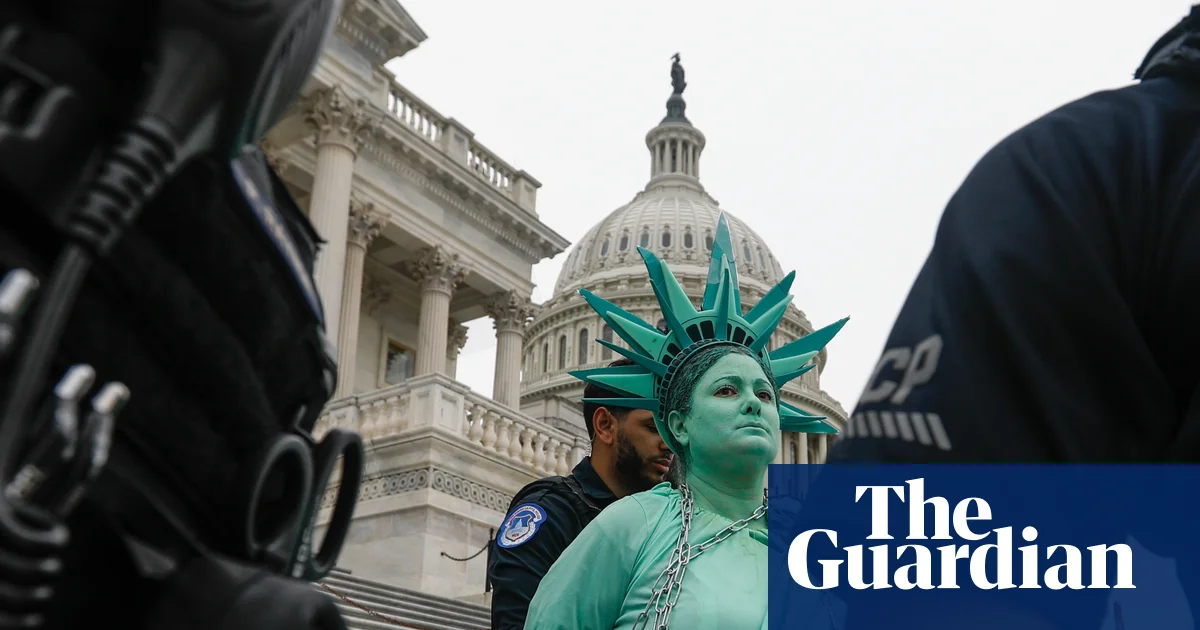 A Trump-Epstein statue, melting democracy and human banners: the art of protesting in 2025 – in pictures – The Guardian