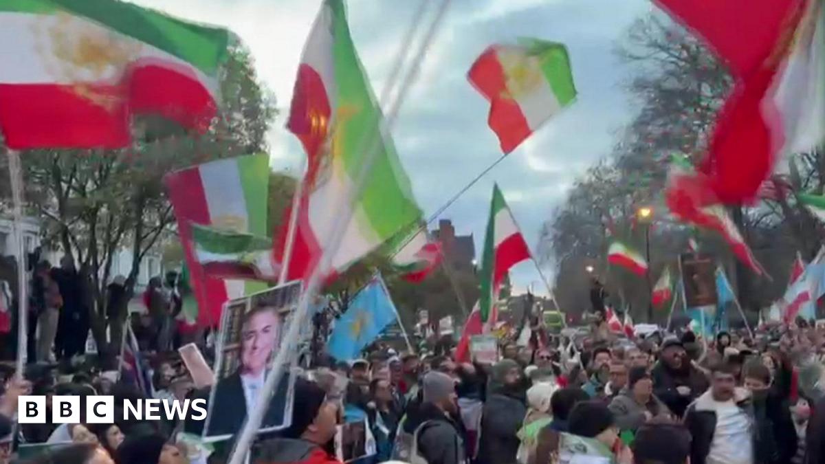 Protester climbs onto balcony of Iranian embassy in London