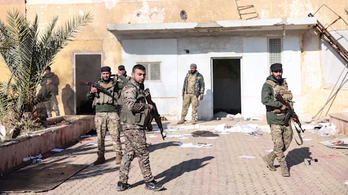 Isis fighters escape Syrian prison after government and Kurdish forces clash Isis fighters escape Syrian prison after government and Kurdish forces clash