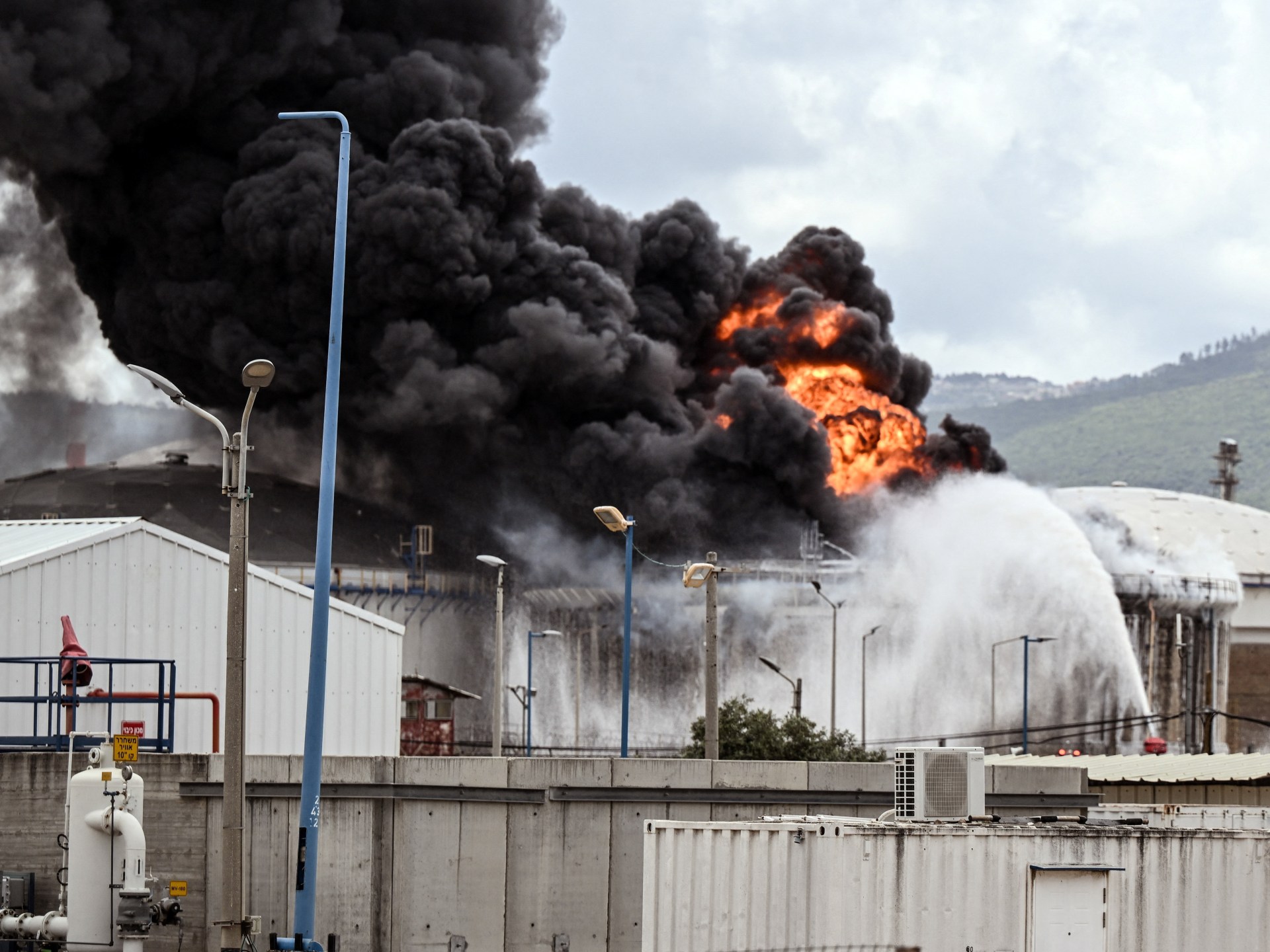 Fire contained after missile attack on oil refinery in Israel’s Haifa | Israel attacks Lebanon News