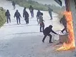 Armed and masked, settlers raid and set fire to West Bank villages, guarded with a military-grade weapon